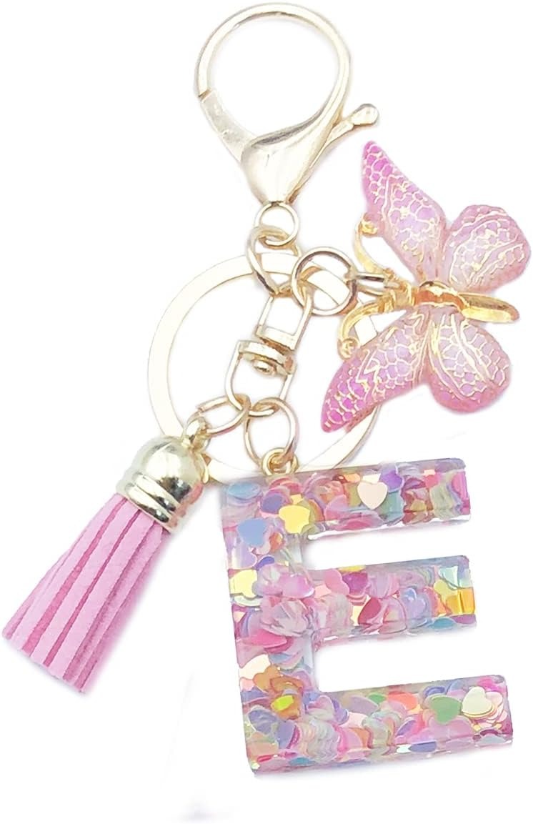 Keychain with letter 'E' charm, tassel, and butterfly